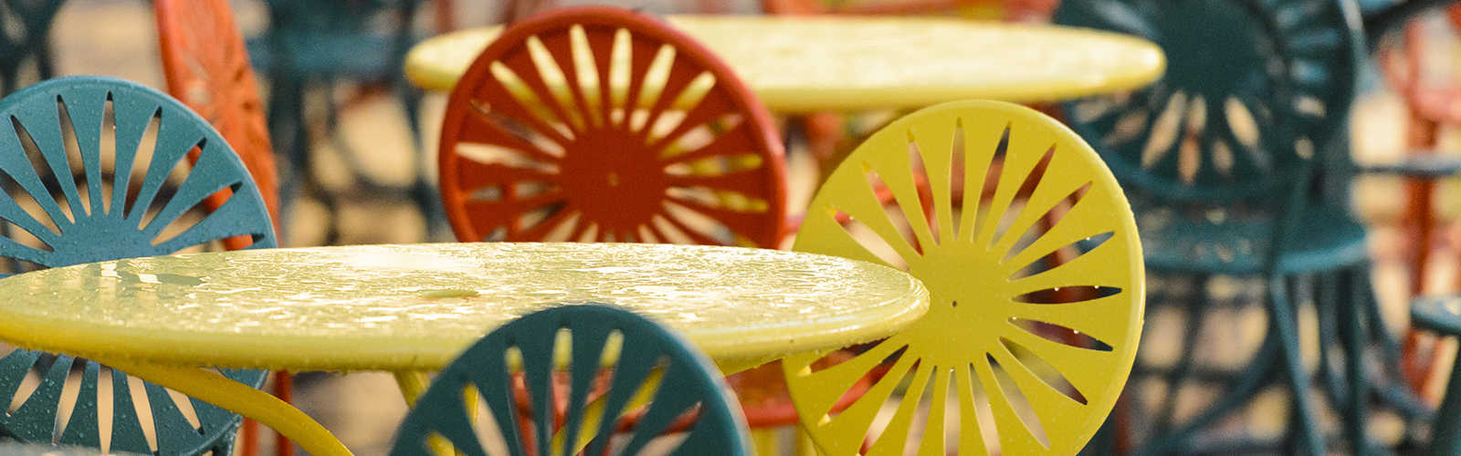 Puddles of rain water dot the Memorial Union Terrace chairs and tables following a passing summer thunderstorm at University of Wisconsin-Madison at sunset on June 28, 2017. (Photo by Jeff Miller / UW-Madison)
