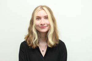 Portrait photo of Alanna Goldstein wearing a black shirt with a necklace.