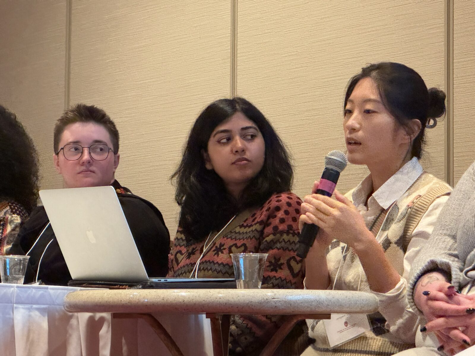 Image of graduate students on a panel