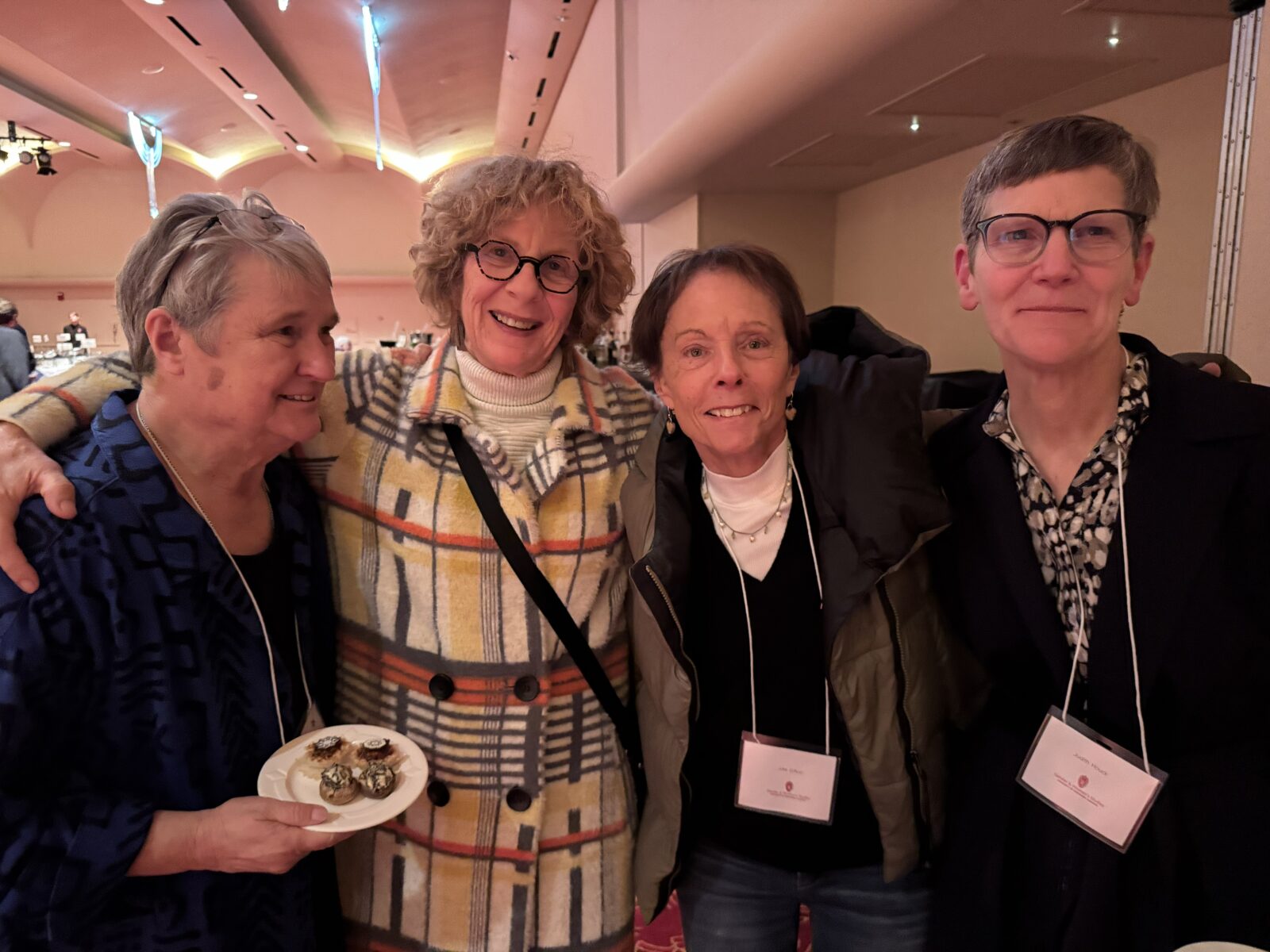 Image of 4 celebration attendees.